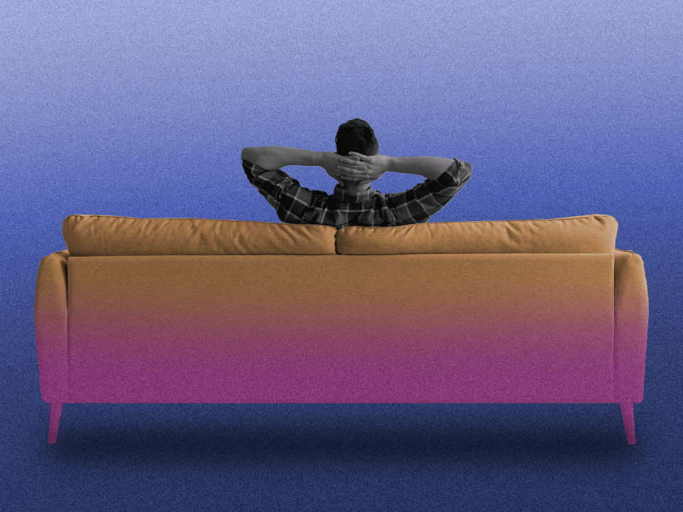 A guy sitting on a couch to represent how to be happy alone